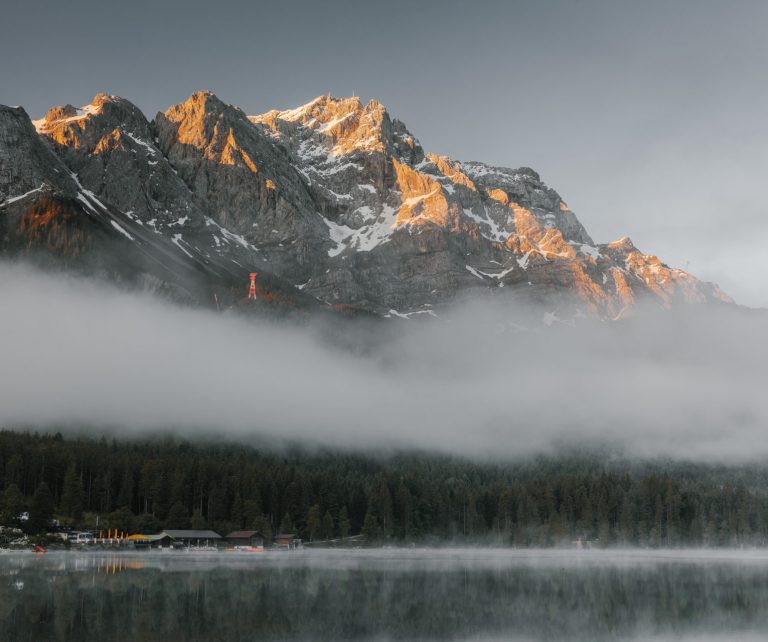 Zugspitze at sunrise with reflection in Eibsee. Garmisch-Partenkirchen. Upper Bavaria. Germany.